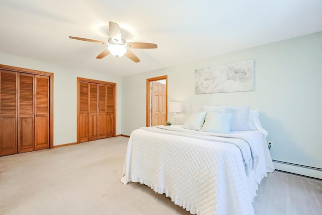 bedroom featuring multiple closets, light carpet, a baseboard radiator, baseboards, and ceiling fan