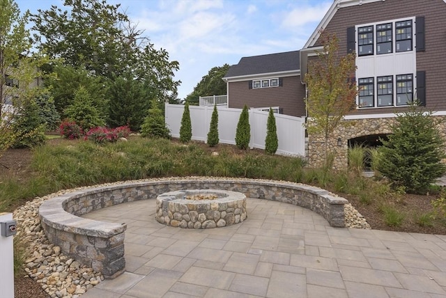 view of patio / terrace with an outdoor fire pit