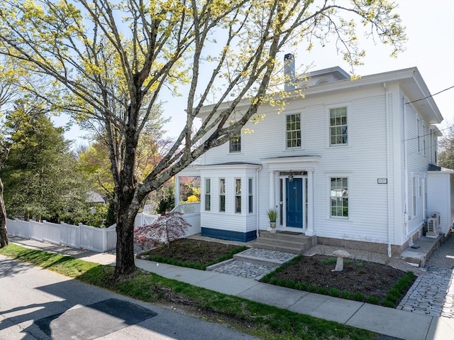 view of front of property with fence and entry steps
