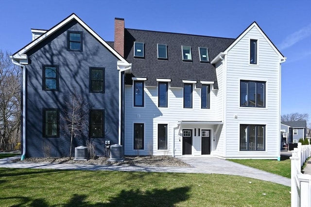 21 Ashland Unit 21, Boston, MA 02122 - view of front of house featuring a chimney, a front lawn, and central AC