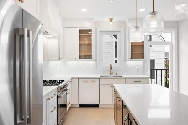 21 Ashland Unit 21, Boston, MA 02122 - kitchen featuring appliances with stainless steel finishes, a sink, custom exhaust hood, tasteful backsplash, and recessed lighting