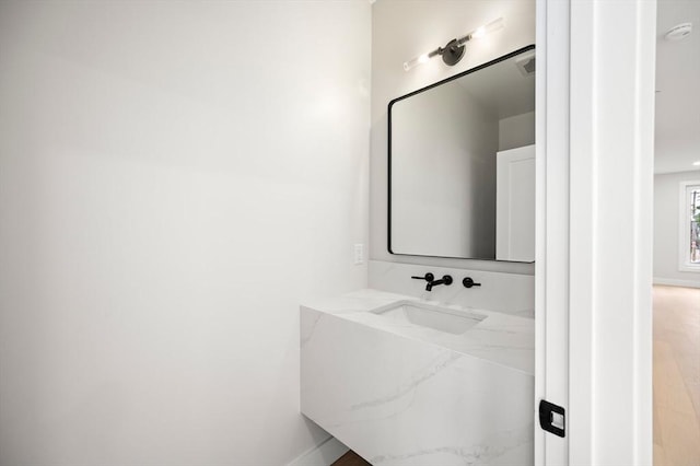 21 Ashland Unit 21, Boston, MA 02122 - bathroom featuring vanity and baseboards