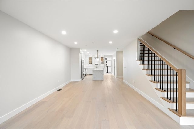 21 Ashland Unit 21, Boston, MA 02122 - unfurnished living room with recessed lighting, light wood-style floors, baseboards, and stairway