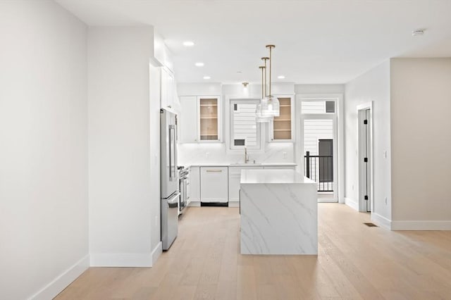 21 Ashland Unit 21, Boston, MA 02122 - kitchen featuring a sink, a center island, baseboards, white cabinetry, and recessed lighting