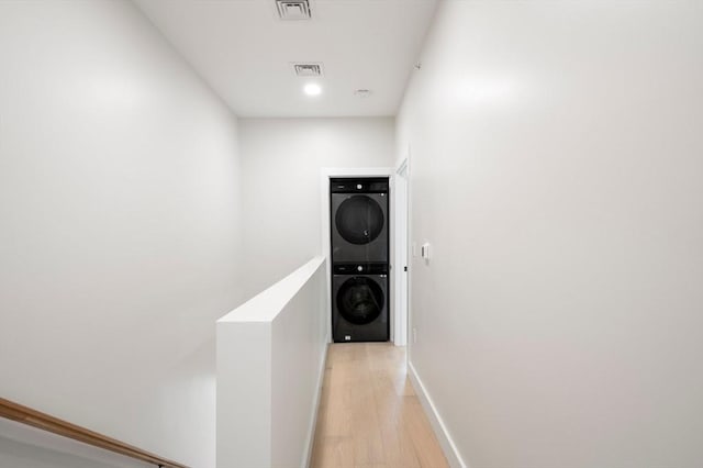 21 Ashland Unit 21, Boston, MA 02122 - washroom featuring estacked washer and dryer, light wood-style floors, baseboards, and recessed lighting