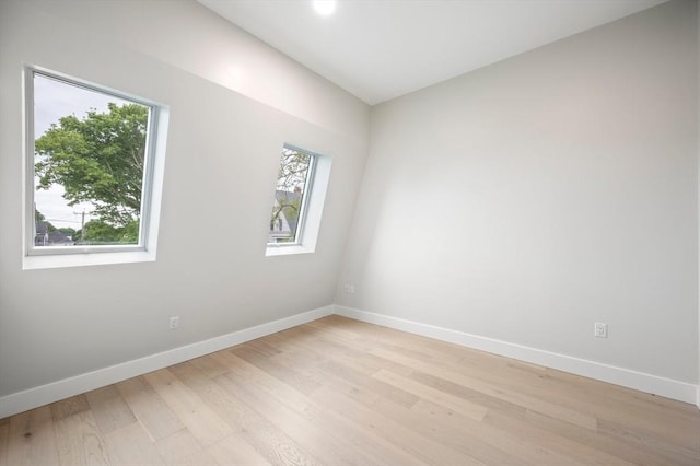 21 Ashland Unit 21, Boston, MA 02122 - empty room featuring healthy amount of natural light, light wood-style flooring, and baseboards