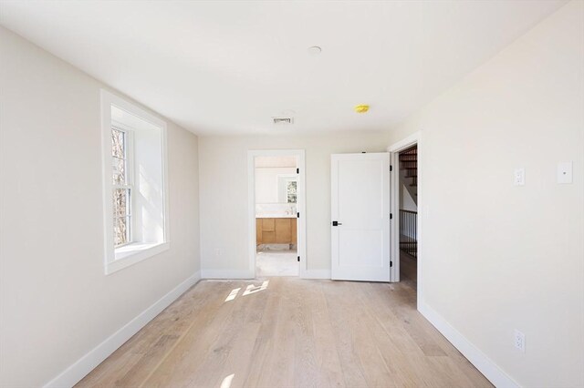 21 Ashland Unit 21, Boston, MA 02122 - spare room with light wood finished floors and baseboards