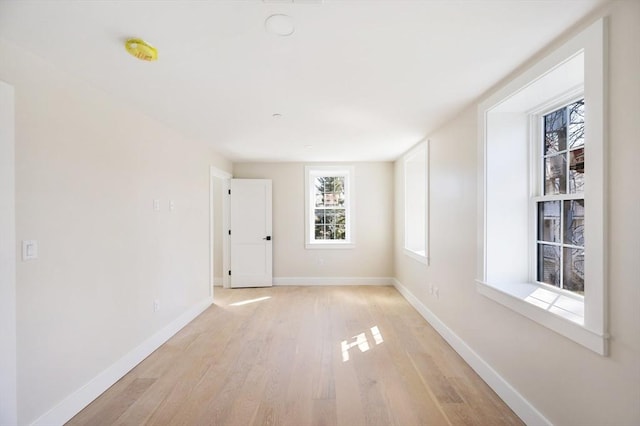 21 Ashland Unit 21, Boston, MA 02122 - empty room featuring light wood-type flooring, baseboards, and a smoke detector