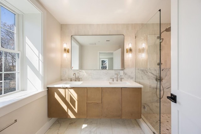 21 Ashland Unit 21, Boston, MA 02122 - full bathroom featuring marble finish floors, a marble finish shower, double vanity, baseboards, and decorative backsplash