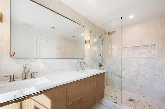 21 Ashland Unit 21, Boston, MA 02122 - bathroom with walk in shower, double vanity, tile walls, marble finish flooring, and tasteful backsplash