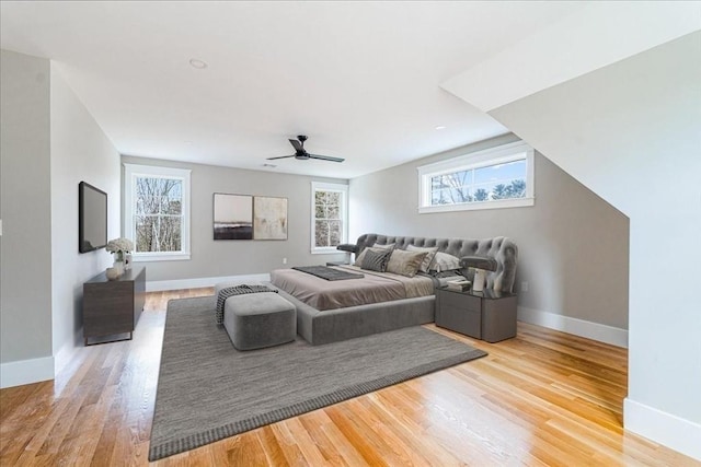 bedroom featuring hardwood / wood-style floors and ceiling fan