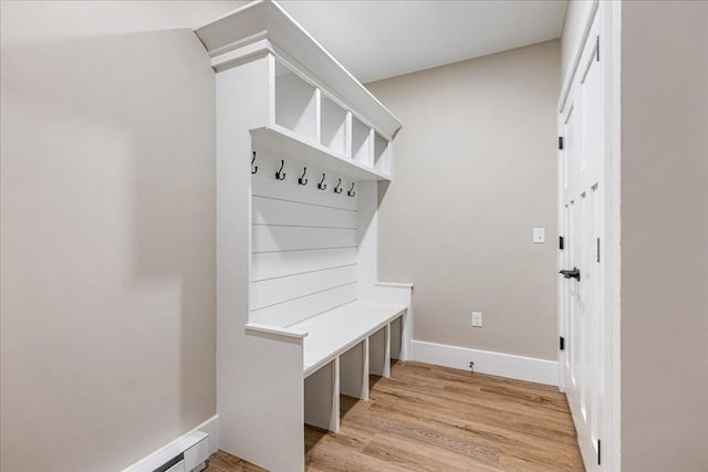 mudroom with light hardwood / wood-style flooring and a baseboard heating unit