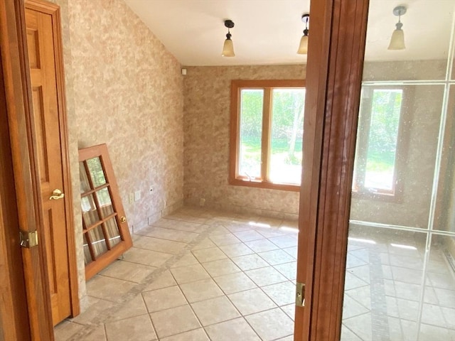 101 Highfields Rd, Abington, MA 02351 - empty room featuring healthy amount of natural light, light tile patterned floors, and wallpapered walls