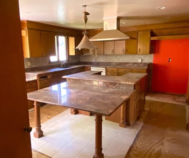 101 Highfields Rd, Abington, MA 02351 - kitchen with a sink, a kitchen island, tasteful backsplash, recessed lighting, and brown cabinets
