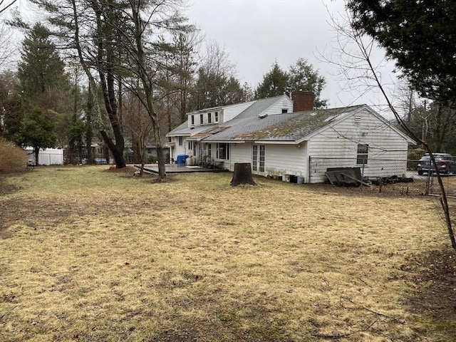 101 Highfields Rd, Abington, MA 02351 - rear view of property featuring a chimney and a patio area