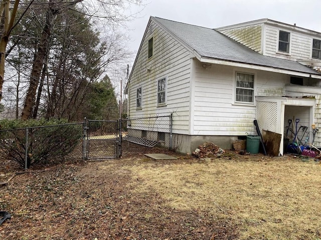 101 Highfields Rd, Abington, MA 02351 - view of side of home with a gate and a shingled roof