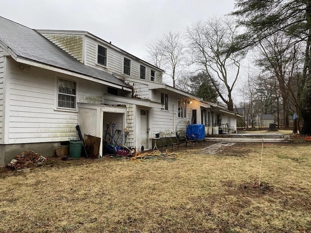 101 Highfields Rd, Abington, MA 02351 - rear view of house featuring a shingled roof and a lawn