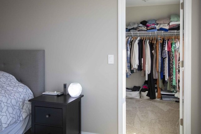 carpeted bedroom featuring a closet