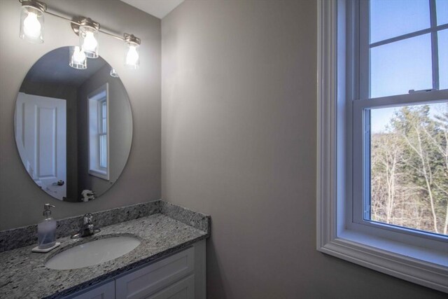 bathroom with plenty of natural light and vanity