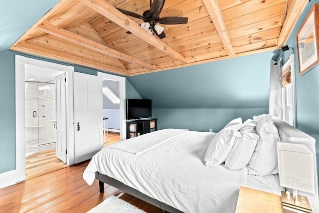 bedroom featuring vaulted ceiling with beams, connected bathroom, a baseboard heating unit, wood ceiling, and wood-type flooring