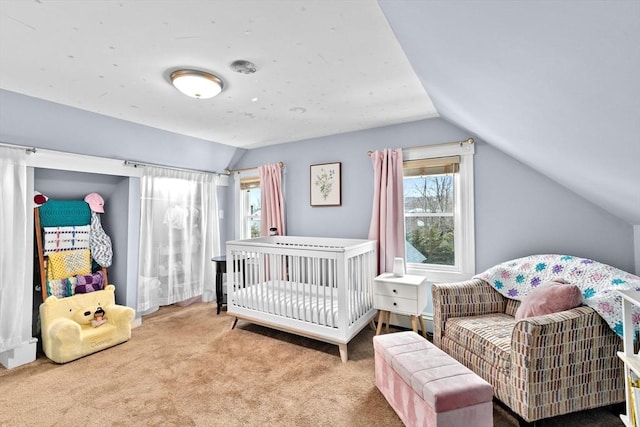 carpeted bedroom with lofted ceiling