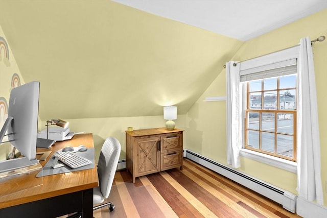 office featuring a baseboard radiator, vaulted ceiling, and wood finished floors