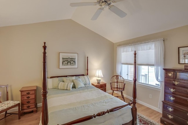 bedroom with light hardwood / wood-style flooring, vaulted ceiling, and ceiling fan