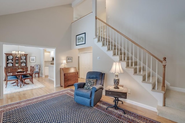 interior space featuring a chandelier, hardwood / wood-style floors, and a high ceiling