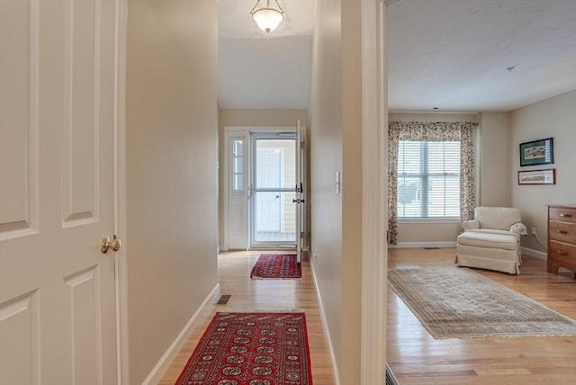 hallway featuring light hardwood / wood-style flooring