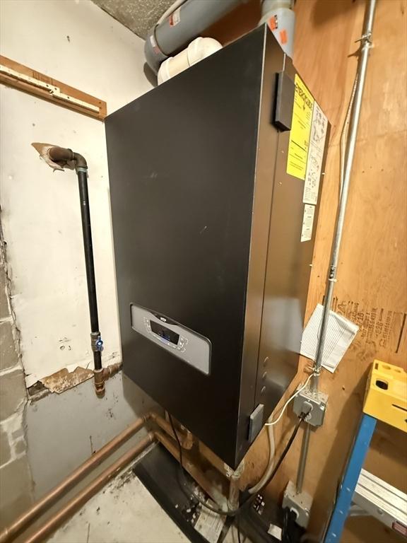 16A Exeter St, Lawrence, MA 01843 - utility room with heating unit