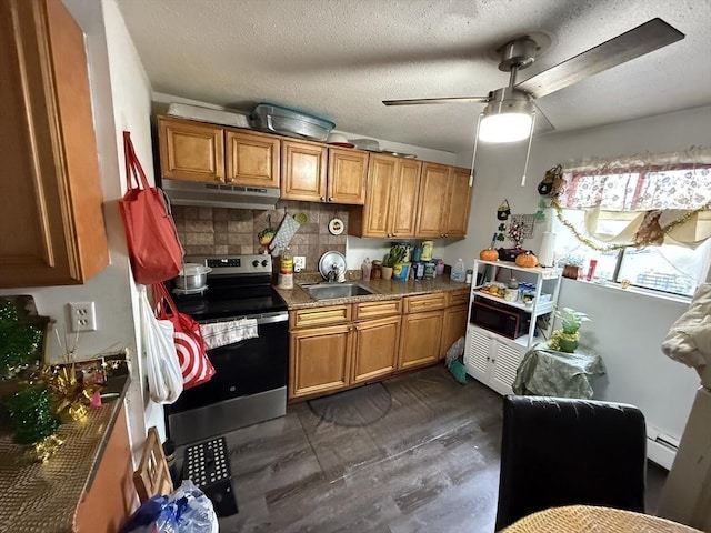 16A Exeter St, Lawrence, MA 01843 - kitchen featuring electric range, under cabinet range hood, brown cabinets, a baseboard heating unit, and ceiling fan