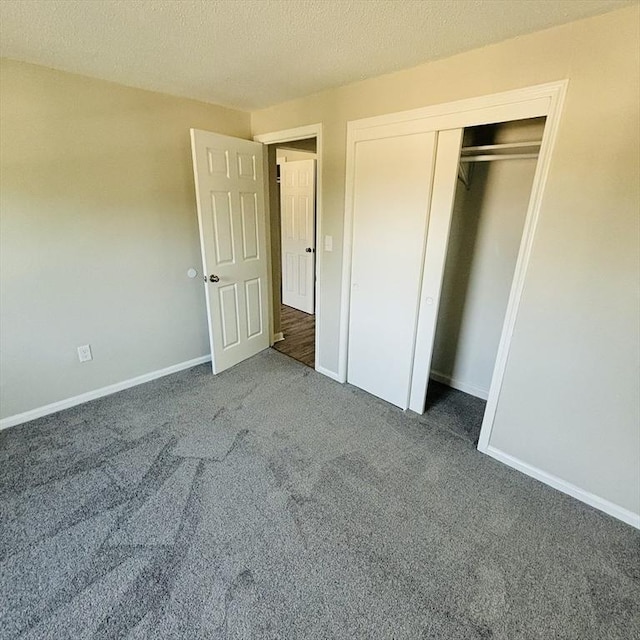 16A Exeter St, Lawrence, MA 01843 - unfurnished bedroom featuring carpet, a closet, and a textured ceiling