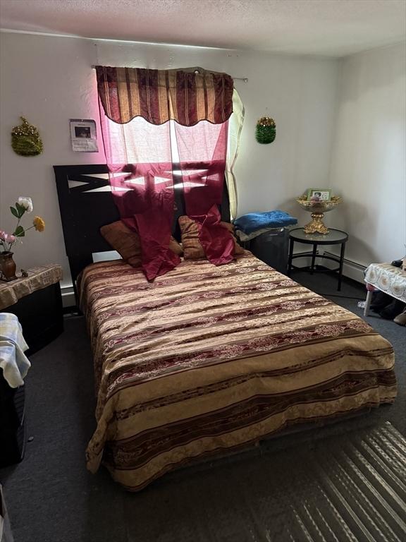 16A Exeter St, Lawrence, MA 01843 - carpeted bedroom featuring a textured ceiling