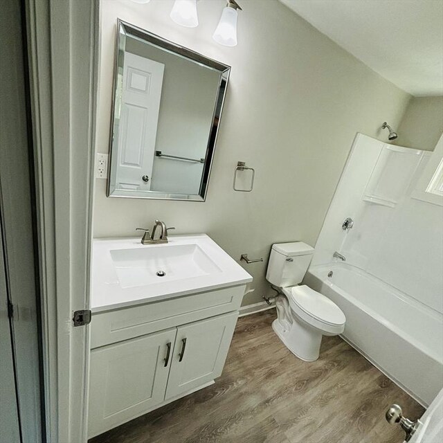 16A Exeter St, Lawrence, MA 01843 - bathroom featuring vanity, wood finished floors, and  shower combination