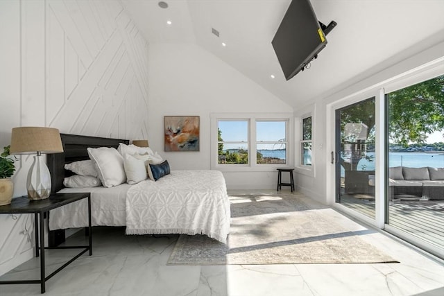 bedroom featuring marble finish floor, access to exterior, a water view, and multiple windows