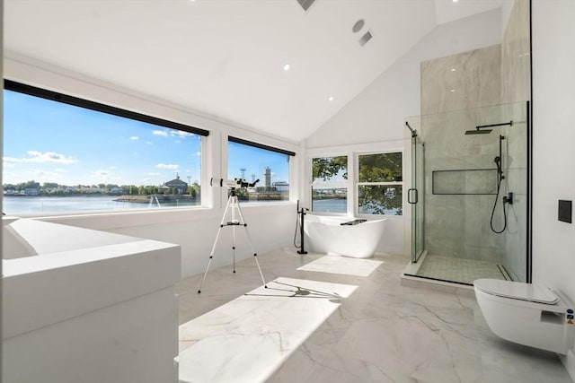 bathroom featuring marble finish floor, a healthy amount of sunlight, a water view, and a shower stall