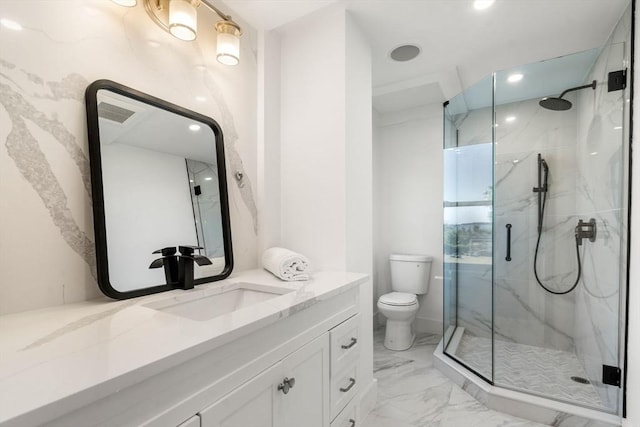 bathroom with marble finish floor, vanity, recessed lighting, a marble finish shower, and toilet