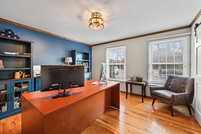 office with crown molding, built in shelves, a textured ceiling, and light hardwood / wood-style flooring