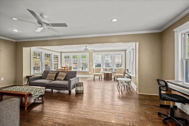 living area featuring crown molding, ceiling fan, recessed lighting, baseboards, and dark wood-type flooring