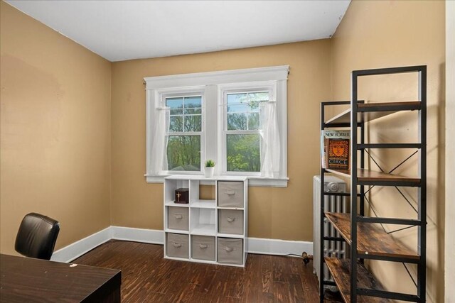 office area featuring baseboards and wood finished floors