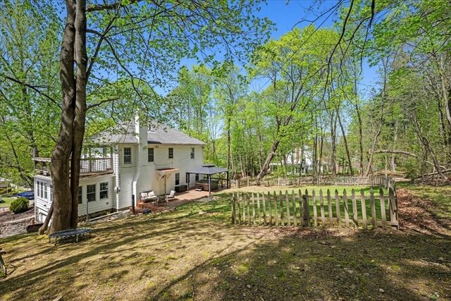 view of yard with a patio and fence