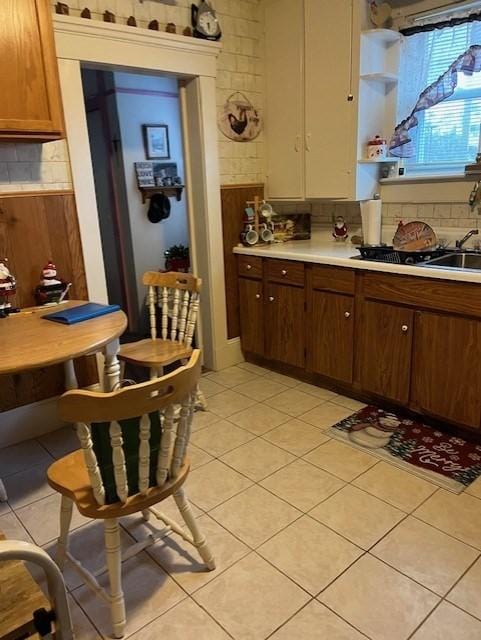 kitchen with backsplash and light tile patterned floors