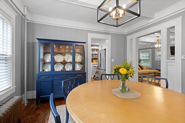 20 Saint Elmo Rd, Worcester, MA 01602 - dining space featuring radiator heating unit, a chandelier, dark wood-style floors, and crown molding