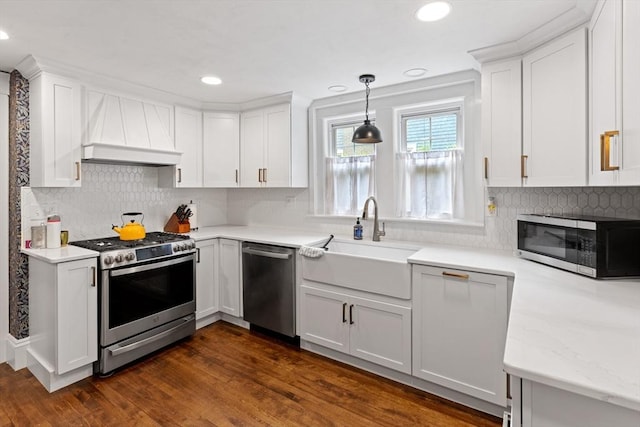20 Saint Elmo Rd, Worcester, MA 01602 - kitchen featuring appliances with stainless steel finishes, custom range hood, a sink, white cabinets, and recessed lighting