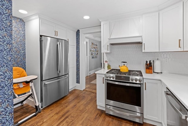 20 Saint Elmo Rd, Worcester, MA 01602 - kitchen featuring stainless steel appliances, custom range hood, wallpapered walls, light countertops, and white cabinets