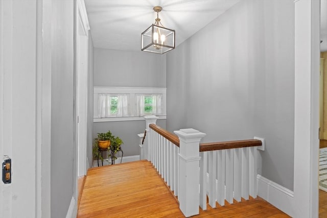 20 Saint Elmo Rd, Worcester, MA 01602 - corridor with an upstairs landing, baseboards, wood finished floors, and a chandelier
