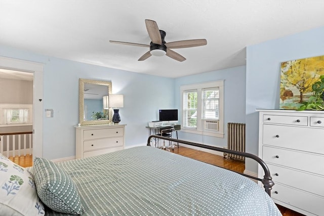 20 Saint Elmo Rd, Worcester, MA 01602 - bedroom featuring wood finished floors, baseboards, radiator, and ceiling fan