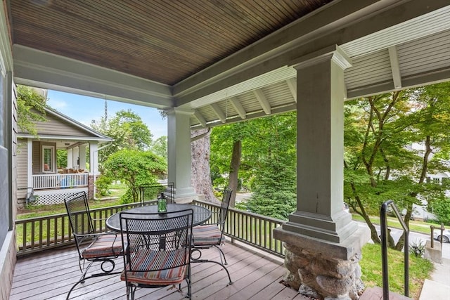20 Saint Elmo Rd, Worcester, MA 01602 - wooden porch featuring outdoor dining area