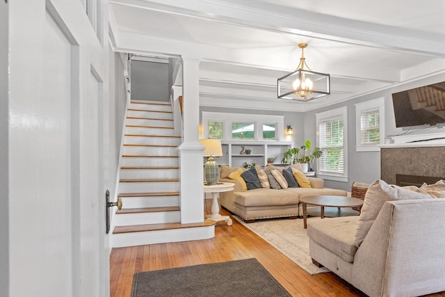20 Saint Elmo Rd, Worcester, MA 01602 - living area featuring stairs, hardwood / wood-style flooring, a fireplace, healthy amount of natural light, and beam ceiling