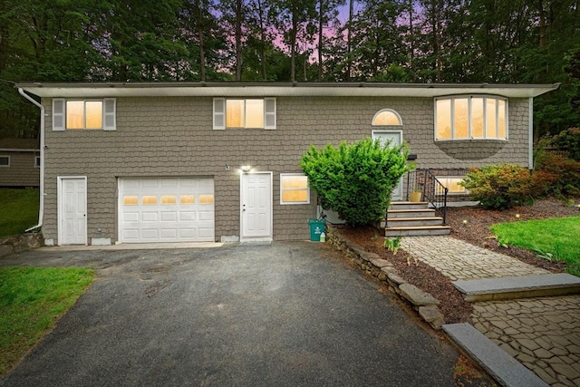 44 Drexel St, Worcester, MA 01602 - bi-level home featuring a garage and asphalt driveway